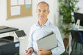 man holding files and folder