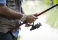 Man holding a fishing stick