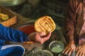 Man holding flatbread in Srinagar