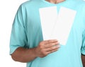 Man holding flyers on white background, closeup. Mockup for design Royalty Free Stock Photo