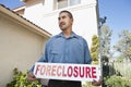 Man Holding ~Foreclosure Sign~ Royalty Free Stock Photo