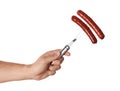 Man holding fork with grilled sausages on white , closeup. Barbecue food