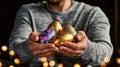 Man showing painted easter eggs with bokeh lights Royalty Free Stock Photo
