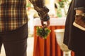 Man holding geranium plant in hand