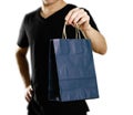 Man holding a gift bag. Close up. Isolated on white background Royalty Free Stock Photo