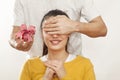 Man holding gift box and giving girlfriend