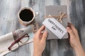 Man holding gift box with HAPPY FATHER'S DAY card on table Royalty Free Stock Photo