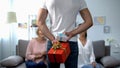 Man holding gift boxes behind back for mother and wife, women day celebration Royalty Free Stock Photo