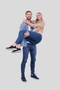 Man Holding Girl in his Arms. Couple Standing Isolated Royalty Free Stock Photo