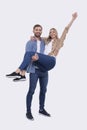 Man Holding Girl in his Arms. Couple Standing Isolated. Lovely Couple Looking to the Camera Girl is Happy Holding Hand Royalty Free Stock Photo