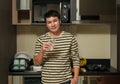 man holding a glass of clean water in home kitchen Royalty Free Stock Photo