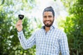 Man holding glass of wine in the park Royalty Free Stock Photo