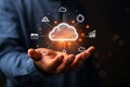 Man holding glowing cloud network with icons representing data and business growth Royalty Free Stock Photo