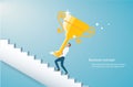 Man holding the gold trophy climbing stairs to success vector illustration eps10 Royalty Free Stock Photo