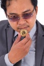 Man holding golden bitcoin in hand isolated on white background Royalty Free Stock Photo