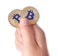 Man holding golden bitcoins on white background Royalty Free Stock Photo