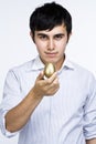 Man holding golden egg Royalty Free Stock Photo