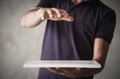 Man holding graphic tablet with protect gesture Royalty Free Stock Photo