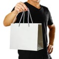 A man holding a gray gift bag. Close up. Isolated on white background Royalty Free Stock Photo