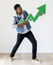 Man holding a green arrow-up icon Royalty Free Stock Photo