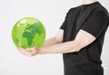 Man holding green sphere globe Royalty Free Stock Photo