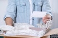 Man holding greeting card near parcel with Christmas gift, closeup Royalty Free Stock Photo