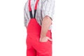 Man holding hand inside back pocket of rompers or coveralls