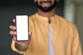 Man holding in hand showing white mock up phone screen cellphone ads template. Royalty Free Stock Photo