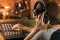 Man holding headphone and listening to live sound . Royalty Free Stock Photo