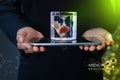 Man is holding a heart in glass of water and tablet computer Royalty Free Stock Photo