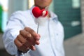 Man Holding A Heart Shape Stick