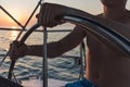 Man holding helm of sailboat yacht Royalty Free Stock Photo