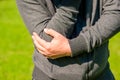 Man holding his elbow arthritic