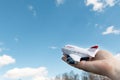 Man is holding in his hand a model of airplan Royalty Free Stock Photo