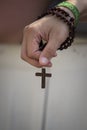 A Man praying with the wood holy Rosary