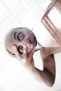Man holding his head in his hand, tired out by the complexity of life, heavy head, burn out Royalty Free Stock Photo