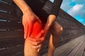 Man holding his painful knee. Runner knee injury and pain. Injury from workout