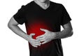 The man is holding his side. Pain in the liver. Cirrhosis. The h Royalty Free Stock Photo