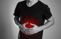 The man is holding his stomach. Abdominal pain. The hearth is hi Royalty Free Stock Photo