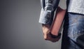 Man holding holy bible with gray background for text Royalty Free Stock Photo