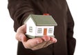 Man holding a house in his hand Royalty Free Stock Photo