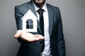 a man holding a house icon in his hand Royalty Free Stock Photo