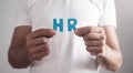 Man holding HR word. Human Resources Royalty Free Stock Photo