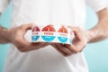 Man holding I vote today stickers roll with American flag