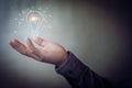 Man holding icon light bulb,idea concept,,Presenting new ideas Royalty Free Stock Photo