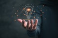 Man holding icon light bulb,idea concept,,Presenting new ideas Royalty Free Stock Photo