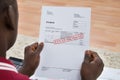 Man Holding Invoice With Final Demand Notification Royalty Free Stock Photo