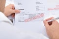 Man Holding Invoice With Final Demand Notification Royalty Free Stock Photo