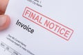 Man Holding Invoice With Final Notice Stamp Royalty Free Stock Photo