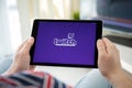 Man holding iPad app Twitch provides streaming game and video